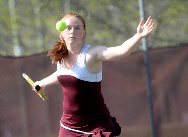 Portsmouth High School's Claudia Waddingham returns a serve during herNo. 1 singles match against Trinity's Laura Caron on Monday in Portsmouth. Photo by Deb Cram/Seacoastonline.com