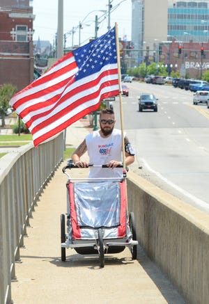 BRIAN D. SANDERFORD • TIMES RECORD Noah Coughlan runs across the Garrison Ave. Bridge, on his way to Sallisaw, on his 65th day of a cross country run “Run for Rare” on Sunday, May 3, 2015. Coughlan began his third cross America run on Feb 28 in New York City and plans to finish on July 4 in San Diego. 
 BRIAN D. SANDERFORD • TIMES RECORD Noah Coughlan runs across the Garrison Ave. Bridge, on his way to Sallisaw, on his 65th day of a cross country run “Run for Rare” on Sunday, May 3, 2015. Coughlan began his third cross America run on Feb 28 in New York City and plans to finish on July 4 in San Diego.