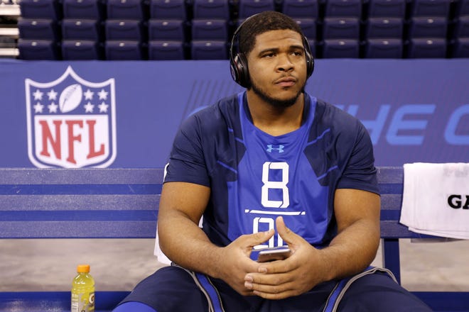 In this Feb. 20, 2015 file photo, La'el Collins sits on a bench at the NFL scouting combine in Indianapolis.