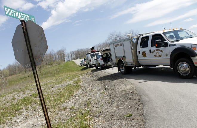 A North Beaver Township Volunteer Fire Department truck sits along Hoffmaster Road near Mohawk School Road late Friday morning. Hoffmaster Road was closed while state police conducted an investigation into the death of Frederick D. Swilling whose body was found along Hoffmaster Road.