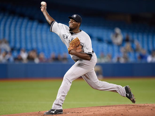 New York Yankees starting pitcher Michael Pineda throws against the Toronto Blue Jays during the first inning of a baseball game Tuesday, May 5, 2015, in Toronto. (AP Photo/The Canadian Press, Frank Gunn)