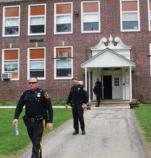 Photo by Bruce A. Scruton/New Jersey Herald - Sussex County sheriff’s deputies leave Wantage Elementary School on Tuesday morning after a lockdown at the school.