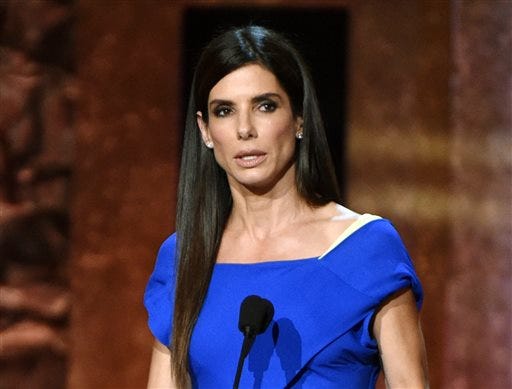 In this June 5, 2014 file photo, Sandra Bullock speaks at the 42nd AFI Lifetime Achievement Award Tribute Gala in Los Angeles. A man arrested inside Bullock's home last year pleaded not guilty to stalking the actress in a Los Angeles courtroom on Wednesday, May 6, 2015. A judge tentatively set a trial date for Joshua James Corbett for July 6. (Photo by John ShearerInvision/AP, File)