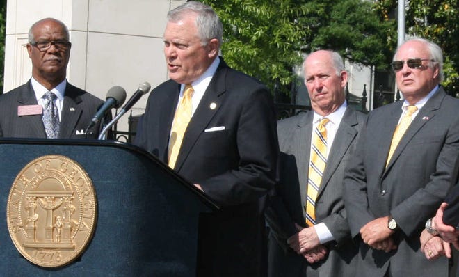 File photo - Gov. Nathan Deal explains why he is about to sign a tax package into law for road maintenance Monday, May 4, 2015 at Liberty Plaza across from the Capitol (Walter JOnes/ Morris News Service)