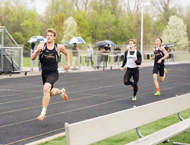 Tecumseh High distance runner Tommy Mammel leads the 1,600 meter race in Tuesday’s intra-county and Southeastern Conference meet against Adrian at Tecumseh High School. Mammel won the 1,600 and the 800 meter runs to help Tecumseh post a 75-59 win.