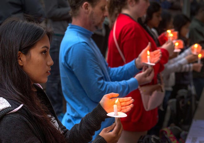 Yasha Bajracharya attends a candlelight vigil for the people of Nepal on the University of Oregon campus on Tuesday evening. Bajracharya, a student at Oregon State University, was in Nepal visiting family when last month’s earthquake hit. (Brian Davies/The Register-Guard)
