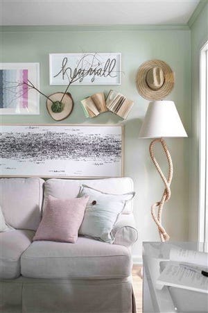 In this photo provided by Brian Patrick Flynn, to create a relaxing spot to unwind, the designer Flynn decorated this living room with soft neutral tones including mossy green and pale pink, and he kept the furniture light and casual by sticking with breathable fabrics such as cotton and linen (HGTV.com/Brian Patrick Flynn via AP)
