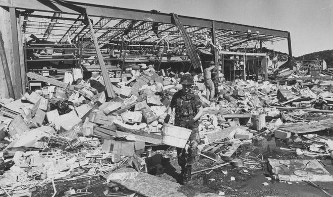 Cleanup begins June 2, 1985, at the back of the Jamesway department store.