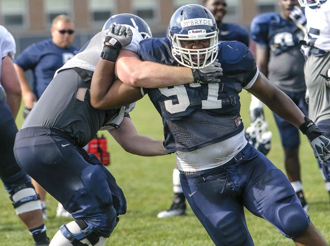 Defensive lineman B.J. McBryde (97), a Beaver Falls native, is shown during Connecticut football practice in Storrs, Conn., in 2012.