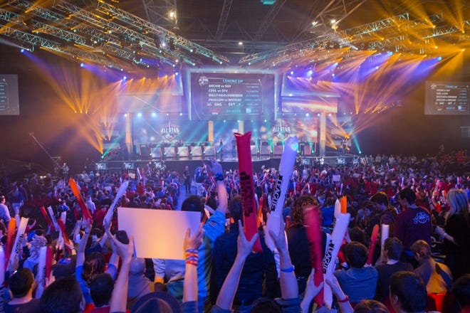 FANS WATCH THE OPENING CEREMONY of the League of Legends Season 4 World Championship Final between South Korea against China's Royal Club in Paris last May. The next ally in competitive gaming's fight for mainstream awareness might be marketers.
