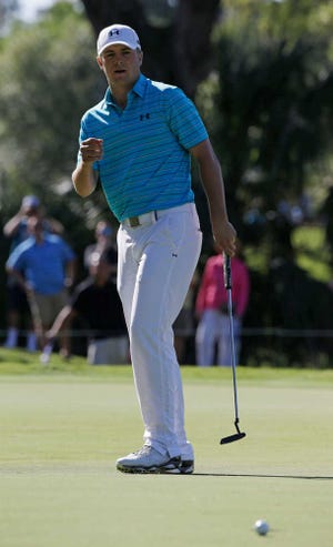 Jordan Spieth reacts as his shot is short of the 11th hole cup during the first round of The Players Championship golf tournament Thursday, May 7, 2015, in Ponte Vedra Beach, Fla., Fla. (AP Photo/John Raoux )