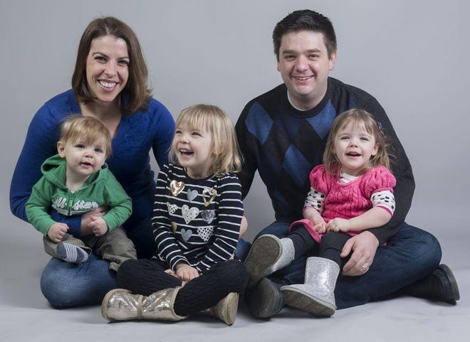 Dorothy and Brian Wallheimer with children (from left) Charlie, 1; Ellie, 5; and Katie, 3.