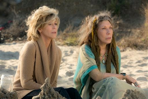 This photo provided by Netflix shows Jane Fonda, left, and Lily Tomlin in the Netflix Original Series "Grace and Frankie," premiering on Friday. (Melissa Moseley/Netflix via AP)