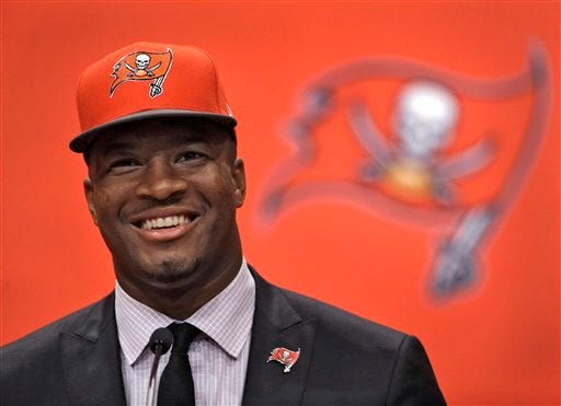 Tampa Bay Buccaneers first-round draft pick Jameis Winston smiles during a news conference Friday, May 1, 2015, in Tampa, Fla. Winston, former Florida State quarterback, was the first overall pick. (AP Photo/Chris O'Meara)