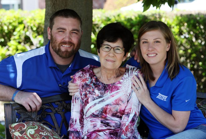 John Teeter and Whitney Berglund are pictured with their mother, Becky Teeter, outside the Ulysses home of Monty and Becky Teeter on Tuesday, April 28, 2015. The Teeter's adopted John when he was 18-months-old and Whitney as a newborn.