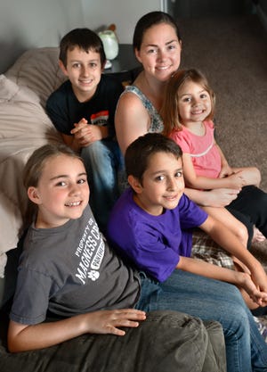 Desiree Reyna poses with her children (clockwise from top left) step-son Eli, daughter, Avery, step-son Mason and daughter Lily. Not pictured is step-son Kaleb.