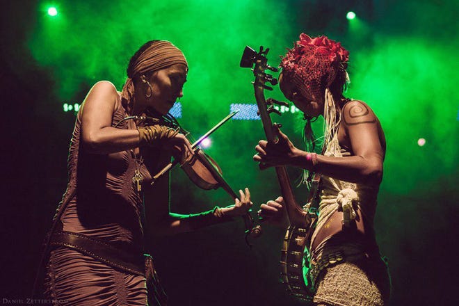 Atlanta-raised sisters Chloe, left, and Leah Smith of "Rising Appalachia" weave their multicultural interests and political activism into their songs.