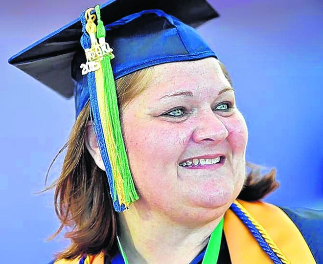 After taking classes over 25 years, Angel Kelly, 43, graduated with a 
bachelor's degree Friday from State College of Florida, Manatee- Sarasota. 
The spring 2015 commencement took place at Van Wezel Performing Arts Hall in 
Sarasota. STAFF PHOTO / THOMAS BENDER