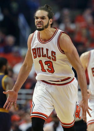 Bulls center Joakim Noah reacts after scoring a basket during the first half 
of Game 3 in a second-round NBA basketball playoff series against the 
Cavaliers in Chicago on Friday night. ASSOCIATED PRESS / NAM Y. HUH