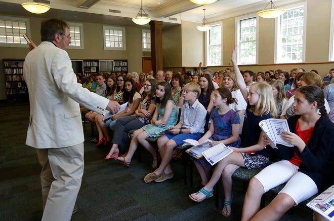 Author Ted Dunagan, left, calls on Morganne Wever, a fifth grader at the Highlands School in Birmingham, as Wever raised her hand to ask a question about Dunagan's book, "A Yellow Watermelon" during the Letters About Literature award ceremony, featuring Dunagan as the guest author, held at Gorgas Library at the University of Alabama in Tuscaloosa, Ala. on Saturday May 9, 2015. staff photo | Erin Nelson