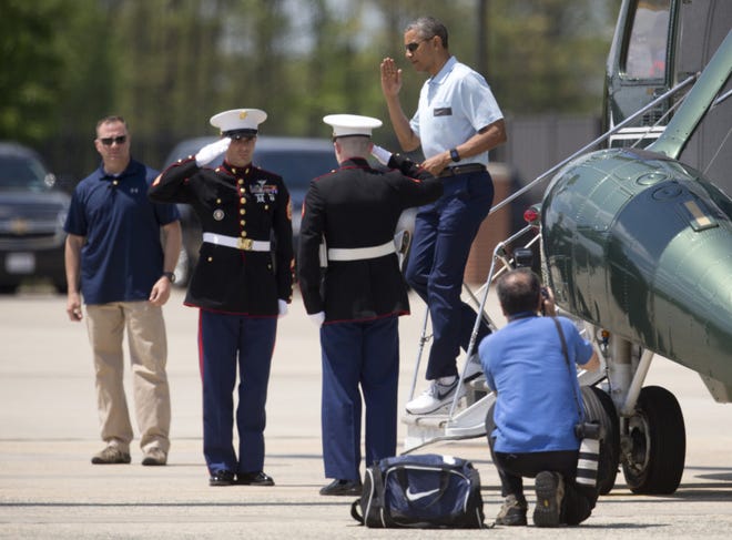 In a May 3 photo, President Barack Obama salutes as he steps off of Marine One, in Andrews Air Force Base, Md., as he returns from the presidential retreat at Camp David, Md. Persian Gulf leaders unnerved by Washington's nuclear talks with Iran and Tehran's meddling across the Mideast look to President Barack Obama to promise more than words and weapons at the Camp David summit on Thursday. They want commitments from Obama that the United States has their backs at a time when the region is under siege from Islamic extremists, Syria continues to unravel, Iraq is volatile and Yemen is in chaos. (AP Photo/Carolyn Kaster)