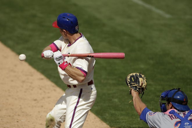 Philadelphia's Chase Utley is hit by a pitch from Mets pitcher Alex Torres during the seventh inning Sunday.