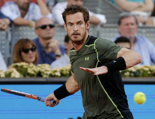 Andy Murray of Britain returns a shot to Rafael Nadal of Spain during their men's singles final match at the Madrid Open Tennis tournament in Madrid, Spain, on Sunday.