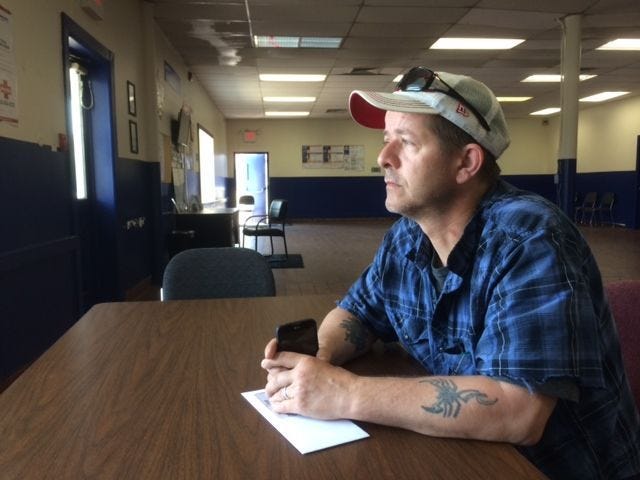 James Pierson, 47, sits at Labor Ready, a temp agency in Bristol Township, seeking work. "I just need a break," he said.