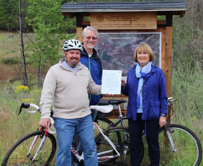 From left, Yreka City Council member and avid cyclist Bryan Foster, Cycle Siskiyou member George Jennings and Cycle Siskiyou and YCC member Joan Smith-Freeman commemorate the city’s proclamation recognizing National Bike Month.