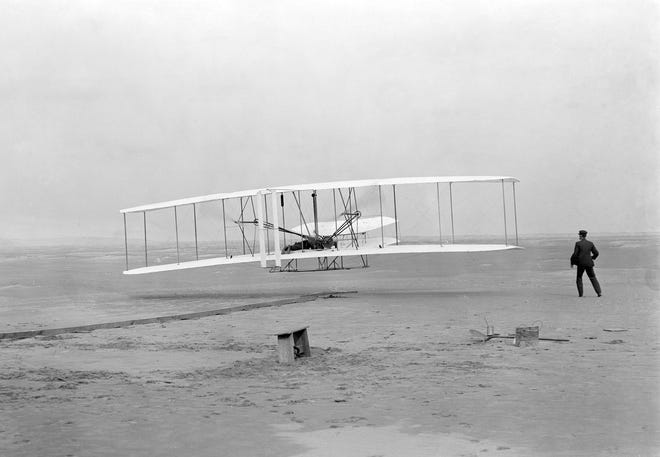 The Wright brothers at Kitty Hawk.