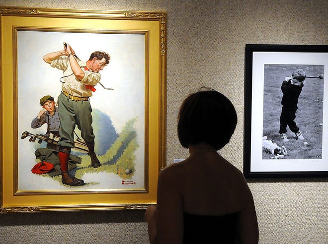 A woman looks at the “In Search of Norman Rockwell’s America” exhibit at the Visual Arts Center of Northwest Florida in Panama City last year. Maxwell Miller resigned as president of the Board of Directors on Wednesday.