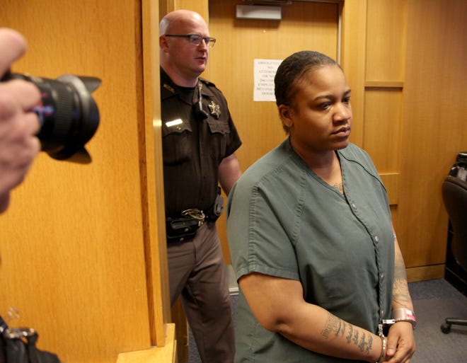 Mitchelle Blair, 35, is led into the courtroom for her arraignment in front of 36th District Judge Kenneth King, Thursday in Detroit, in the slayings of two of her children whose bodies were found in a deep freezer. A plea of not guilty was entered on her behalf, and a preliminary examination was scheduled for June 19.