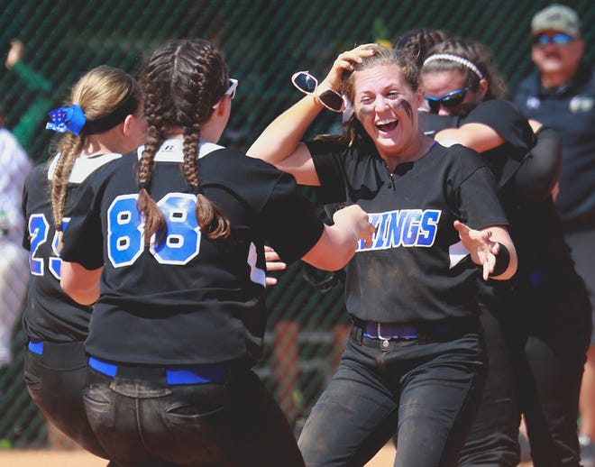 LAKELAND CHRISTIAN'S Kayla Mudger, right, and Emily McKinney (88) celebrate their victory over Westminster Christian School in the FHSAA Class 3A softball championship game in Vero Beach this month. The Vikings had a harrowing final inning in that game but held on to win 6-5.