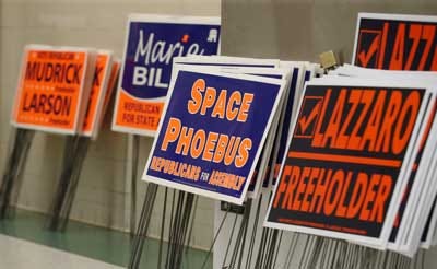 Photo by Jake West/New Jersey Herald A collection of campaign signs rests on the sidlines at the Sussex County Republican Committee’s candidates night Tuesday at the Sussex County Technical School in Sparta.