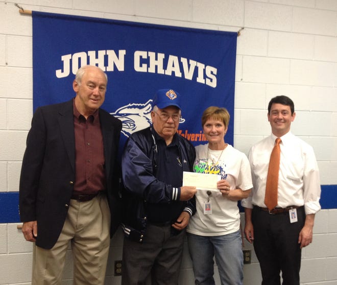 Gene Courtemanche and Nick Coffey, of the Knights of Columbus, are pictured with John Chavis Middle School exceptional children’s teacher Ilene Dellinger and Principal Bryan Denton.