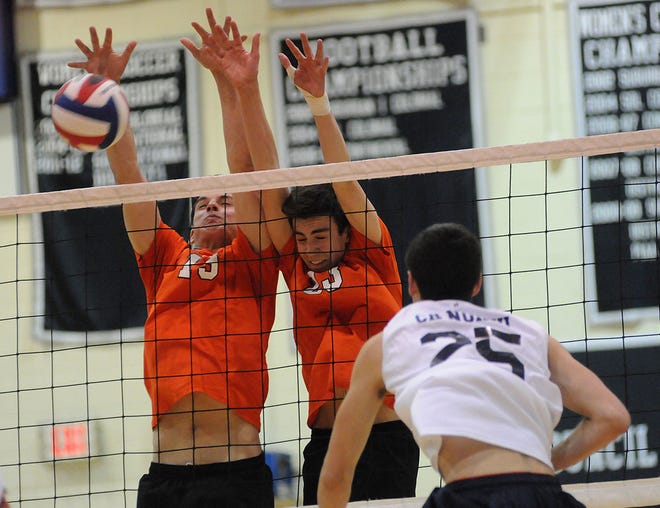 Pennsbury's Kenny Hickman (19) and Sean Sweeney (23) push a ball back over the net from Council Rock North's Sean Lyon (25) during their game at Council Rock North on Thursday, May 15, 2015.