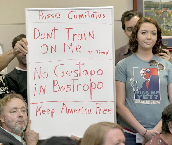 A sign at a public hearing about the Jade Helm 15 military training exercise in Bastrop, Texas, Monday April 27, 2015. (Jay Janner/Austin American-Statesman via AP)