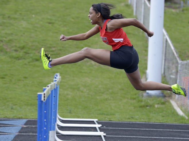 Sewickley Academy's Aja Thorpe clears the last hurdle on the way to first place in the 100-meter hurdles during the Warrior Track Classic. Thorpe is one of the favorites in the 100 and 300 hurdles at Thursday's WPIAL championships.