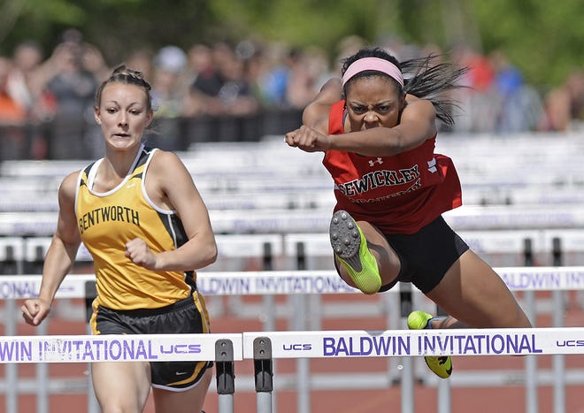 Aja Thorpe, of Sewickley Academy, clears the last hurdle to place first in the 100 meter hurdles at the WPIAL Class AA track championships Thursday afternoon at Baldwin High School. She added a silver in the 100 meters and a bronze in the 300 hurdles.