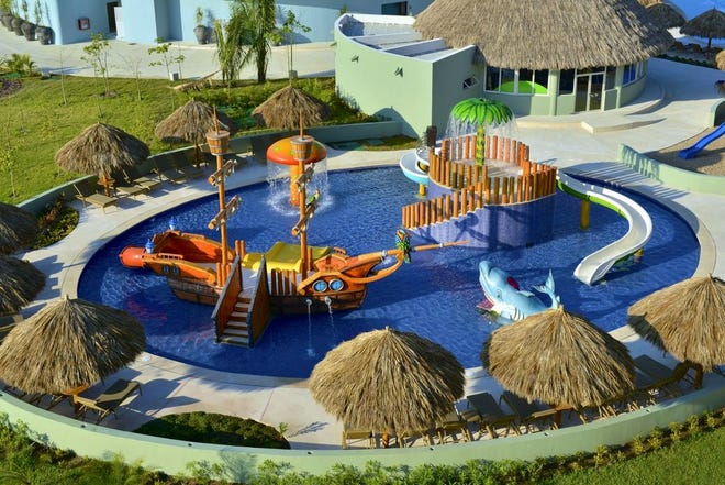 RESORTS ARE UPPING THEIR GAME to appeal to families — everything from family rooms complete with kids' bath amenities, sand toys and bunk beds to the Star Splash water play area, seen here, at the Iberostar Playa Mita in Puerto Vallarta.