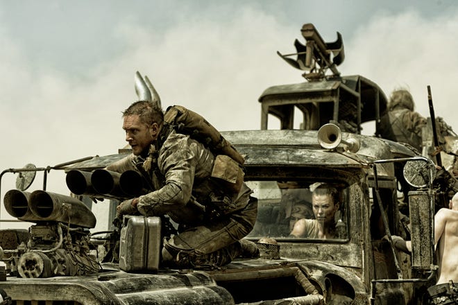 Max (Tom Hardy) and Furiosa (Charlize Theron) try to hold off the bad guys in "Mad Max: Fury Road."