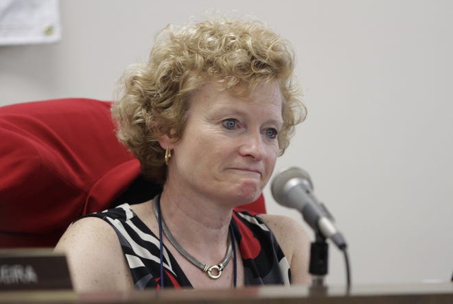 Providence Schools Superintendent Susan Lusi listens to one of the many speakers praise her tenure as superintendent during a May 11 hearing. Lusi announced her resignation, effective this summer, in early May. The Providence Journal/Kris Craig