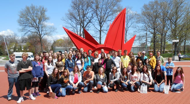 The RHS art classes stand in front of Alexander Calder's sculpture called "Stegosaurus." COURTESY PHOTO