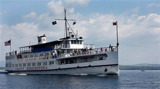 The M/S Mount Washington cruises across lake Winnipesaukee with tourists Sunday May 17, 2015 in Alton, N.H. Nearing the end of the legislative session lawmakers are considering significant cuts to tourism promotion funding as they put together a budget for the next two years. (AP Photo/Jim Cole)