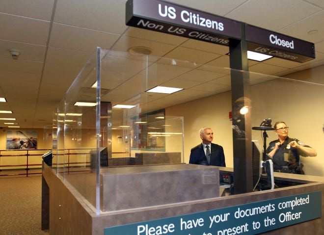 U.S. Sen. Jack Reed, with Helen T. Sterling of U.S. Customs and Border Protection, tours the international arrivals section of T.F. Green Airport on Monday. The Providence Journal/Mary Murphy