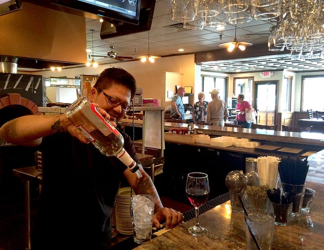 Bartender Richie Walker pours a drink at Charley's Other Brother, a longtime bar and restaurant in Eastampton.