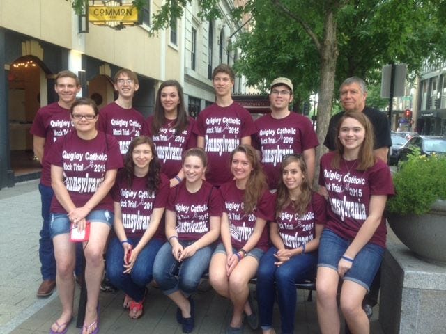 Members of the Quigley Catholic Mock Trial team pose for a photo on a street in Raleigh, North Carolina, during the National High School Mock Trial Championship.