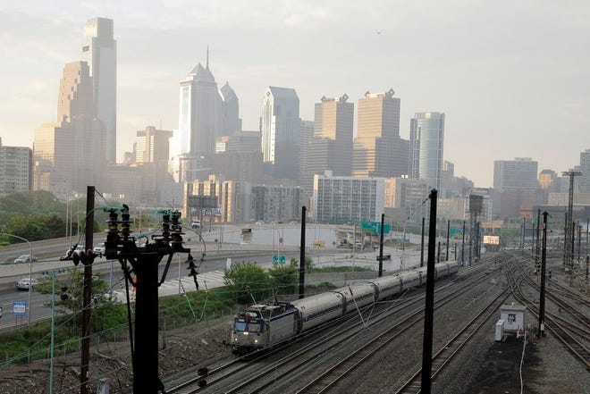 An Amtrak train travels northbound from 30th Street Station, Monday, May 18, 2015 in Philadelphia. Amtrak's Northeast Corridor trains resumed service Monday following last week's deadly derailment that killed eight people and injured more than 200 others. (AP Photo/Matt Slocum)