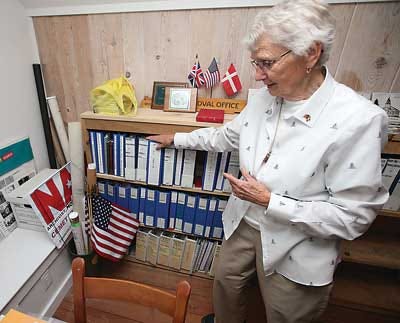 Photo by Daniel Freel/New Jersey Herald - Nan Horsfield, of Sandyston, shows some historical archives of her family lineage in her attic on Tuesday.