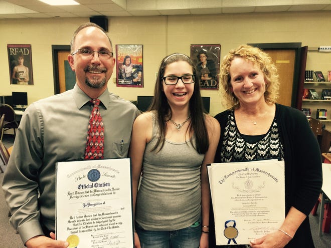 Teacher Keith Ventimiglia and school nurse Jacqueline Berube, right, are credited with saving the life of 14-year-old Tantasqua Junior High School student Kathryn Henry, center. T&G Staff/Craig S. Semon